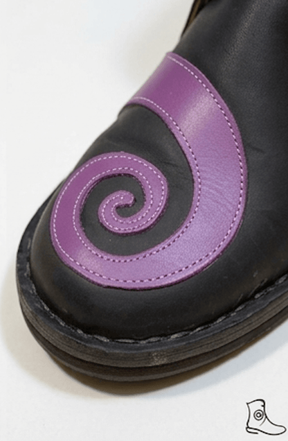 Black handmade medieval shoes featuring a purple swirl design, ideal for historical reenactment and LARP footwear.