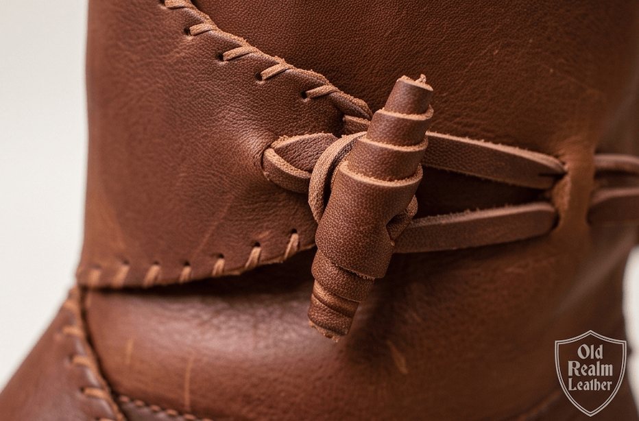 Handmade Viking Leather Boots for LARP & Renaissance Fairs, showcasing brown full-grain leather with toggles and intricate stitching.