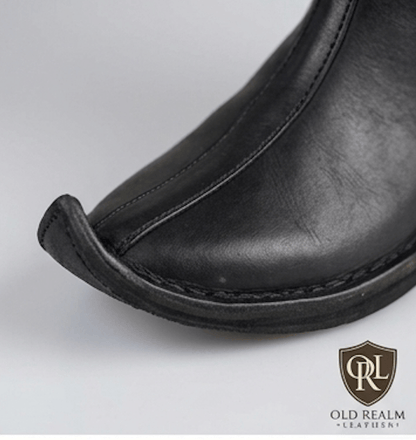 Men's Handmade Medieval Poulaine Boots featuring a sleek black full-grain leather with a distinctive pointed toe.
